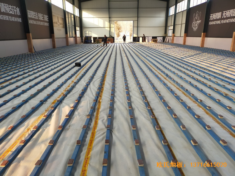 山東北環路平安行駕校籃球館體育木地板施工案例1
